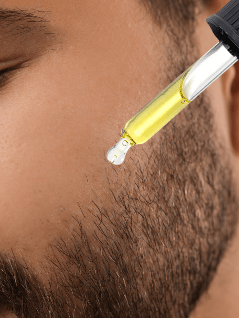 Eclat Soin Softening Beard Oil in a dropper bottle, ideal for grooming and conditioning facial hair